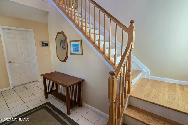 a bathroom with a granite countertop sink toilet a mirror and shower