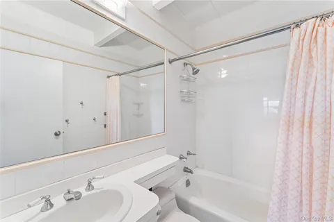 a bathroom with a bathtub and a sink