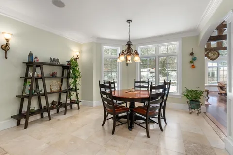 a room with lots of furniture and wooden floors