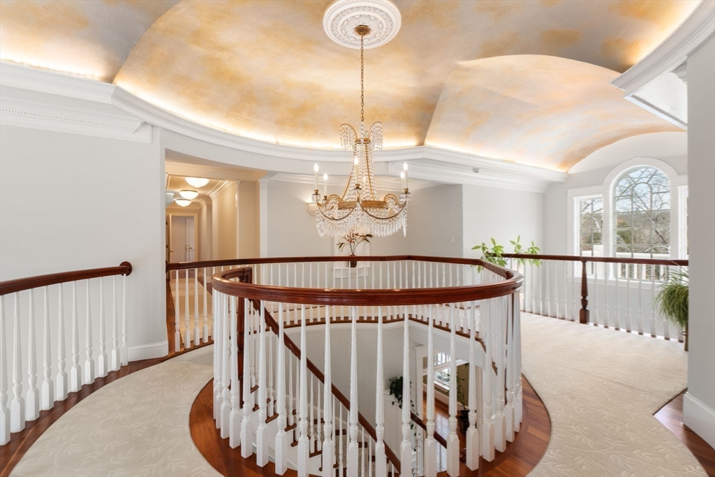 5 Hamlins Crossing West Dover, MA 02030 - Photo 22 of 40 a view of a hallway with a dining table chairs a chandelier