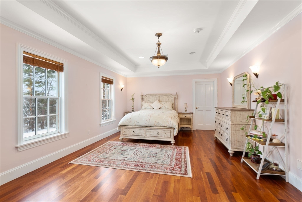 5 Hamlins Crossing West Dover, MA 02030 - Photo 28 of 40 a bedroom with a bed and wooden floor