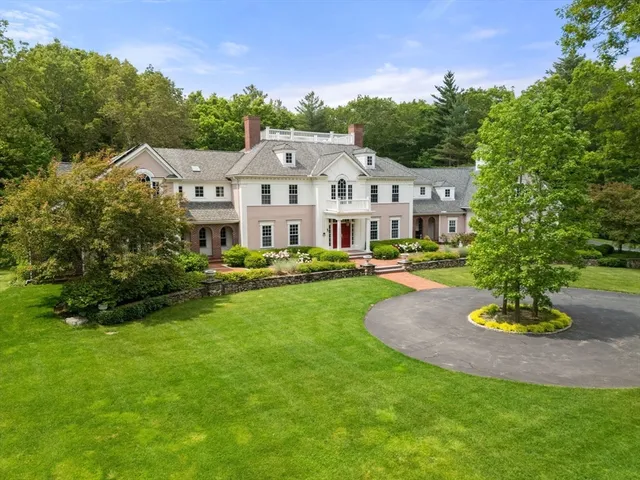 a view of a garden with a house
