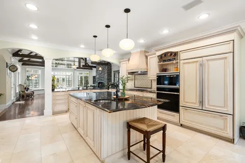 a living room with wooden floor and a table