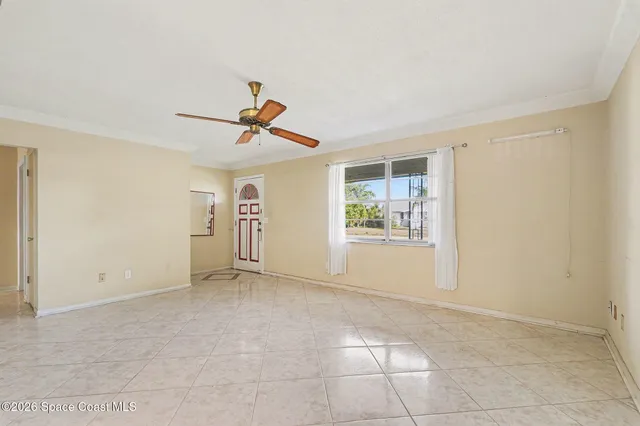 a view of an empty room with a window