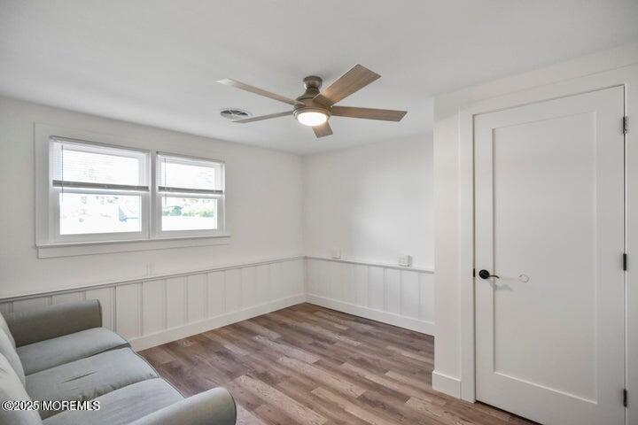 7 Kaylen Place Hazlet, NJ 07730 - Photo 16 of 22 a view of empty room with wooden floor and fan