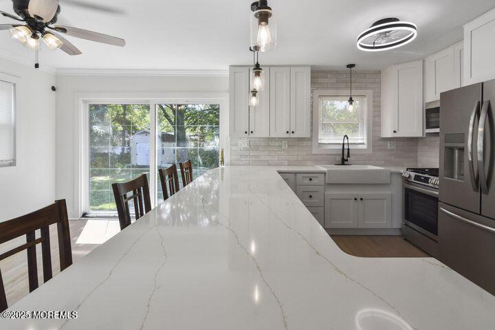 7 Kaylen Place Hazlet, NJ 07730 - Photo 2 of 22 a kitchen with a sink appliances cabinets and a large window