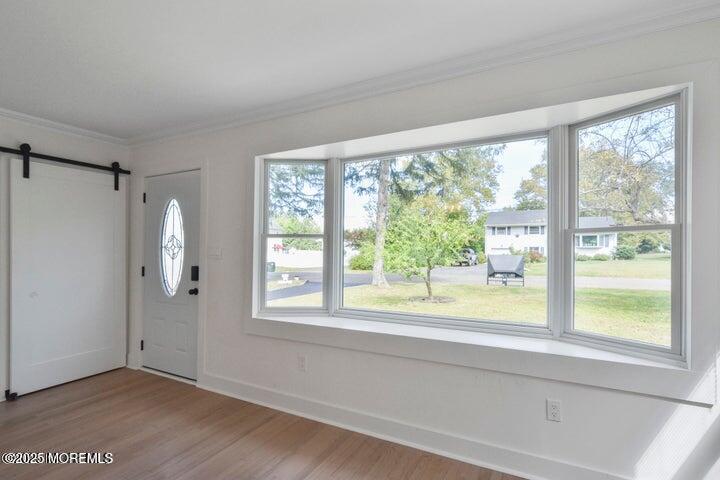 7 Kaylen Place Hazlet, NJ 07730 - Photo 6 of 22 a view of an empty room with a window and wooden floor
