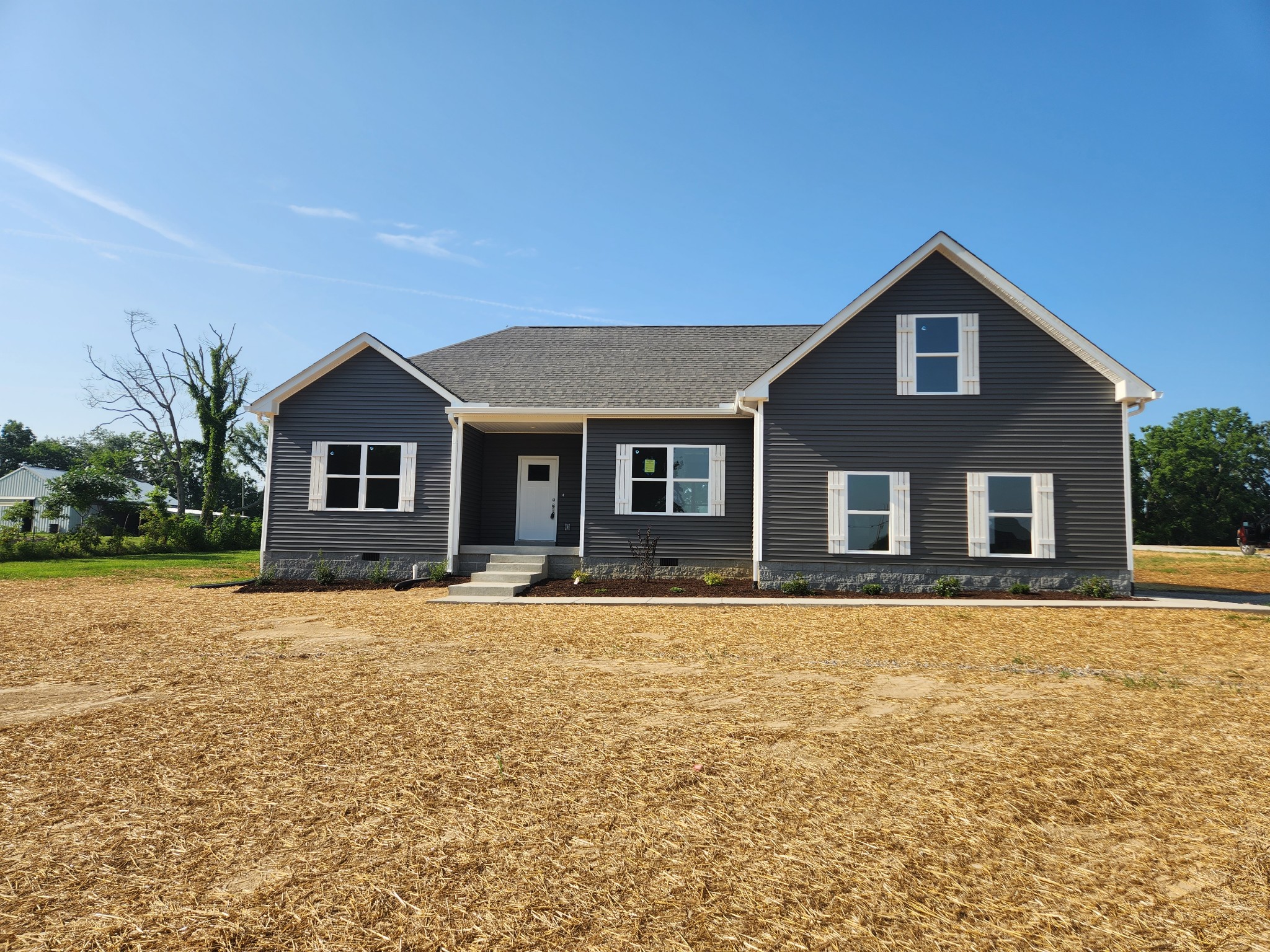 7687 Covington Road White House, TN 37188 - Photo 1 of 16 a front view of a house with yard