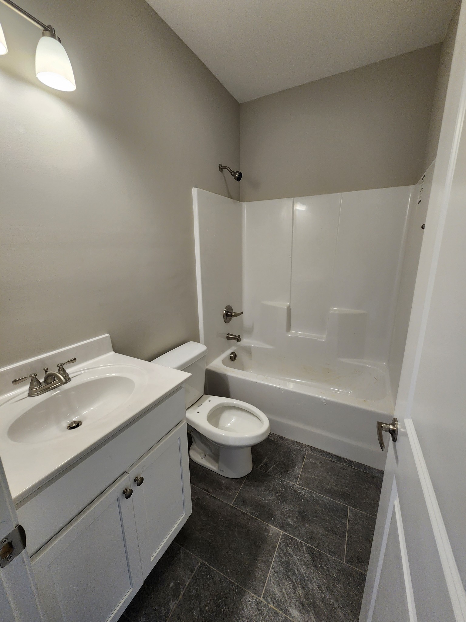7687 Covington Road White House, TN 37188 - Photo 15 of 16 a bathroom with a sink a toilet and shower