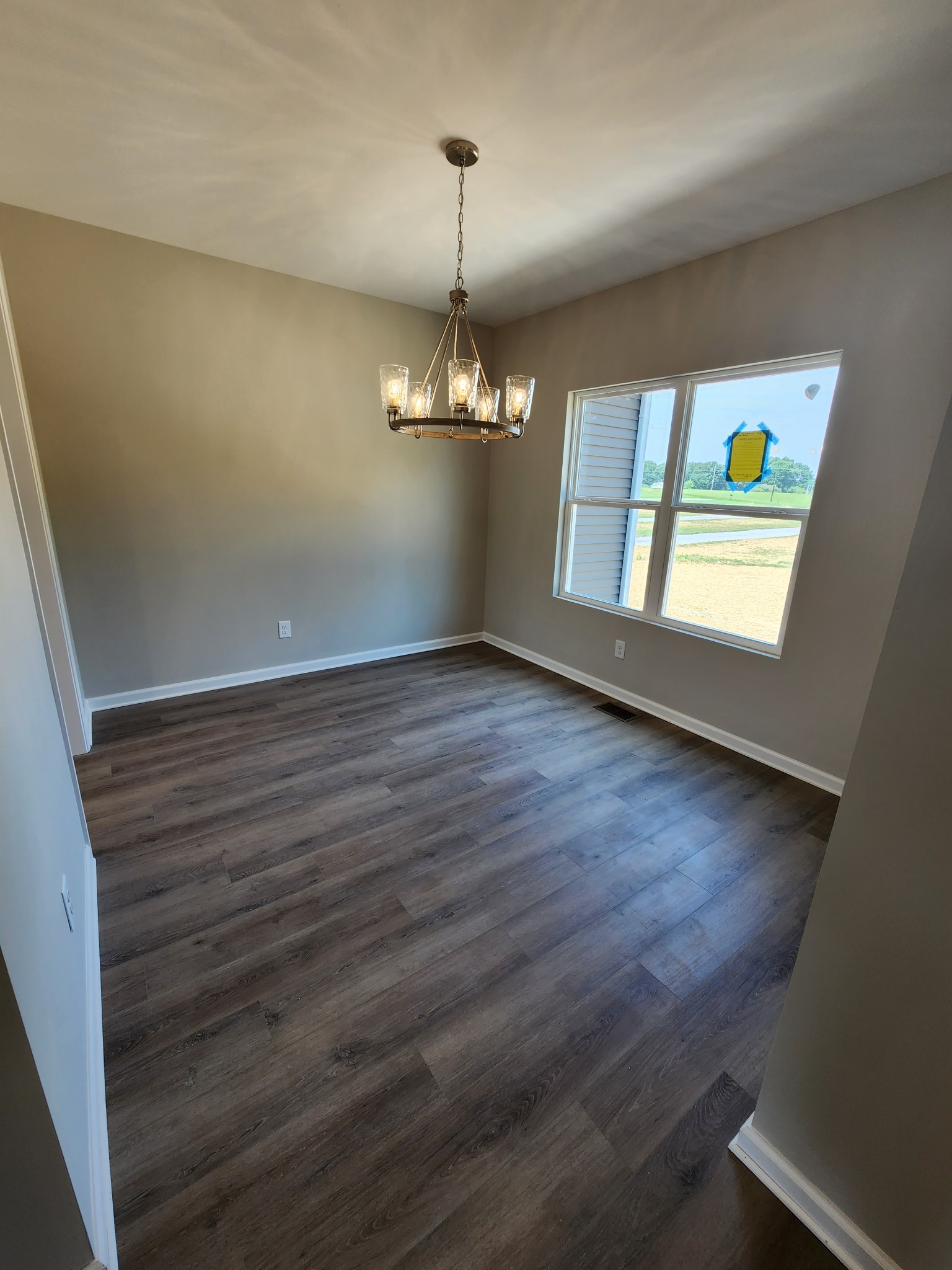 7687 Covington Road White House, TN 37188 - Photo 16 of 16 wooden floor in an empty room with a window