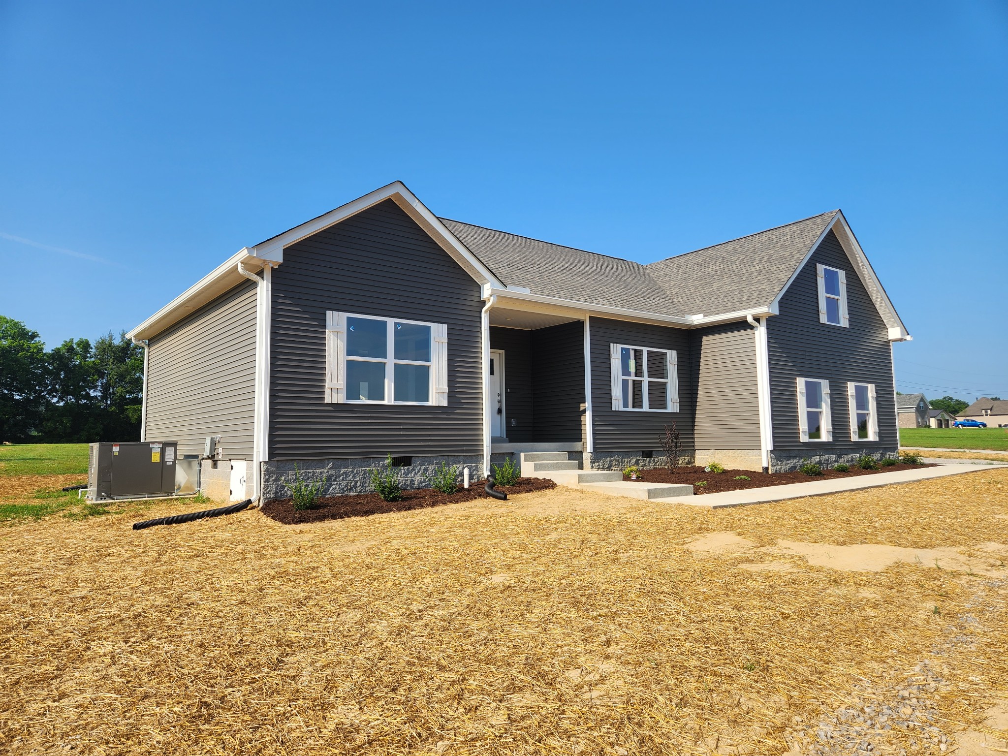 7687 Covington Road White House, TN 37188 - Photo 4 of 16 a front view of a house with a yard