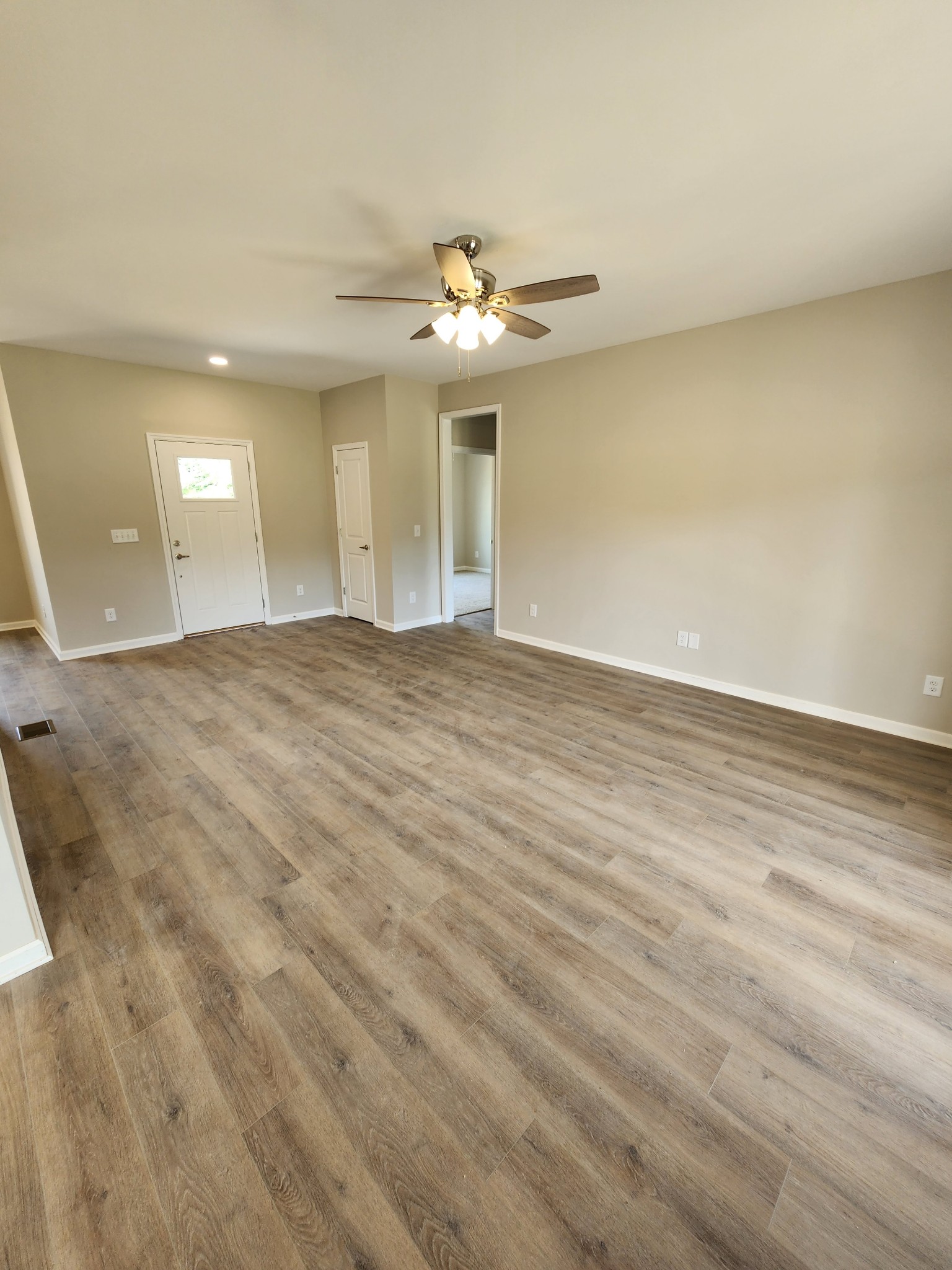 7687 Covington Road White House, TN 37188 - Photo 6 of 16 wooden floor in an empty room