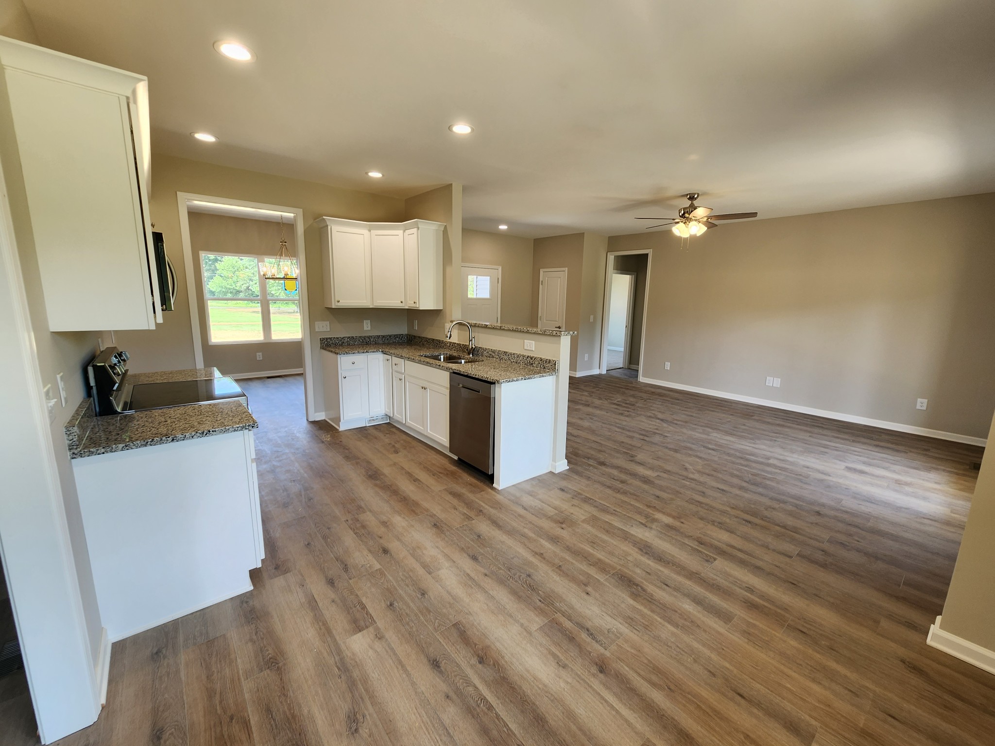 7687 Covington Road White House, TN 37188 - Photo 8 of 16 a view of kitchen with sink and wooden floor
