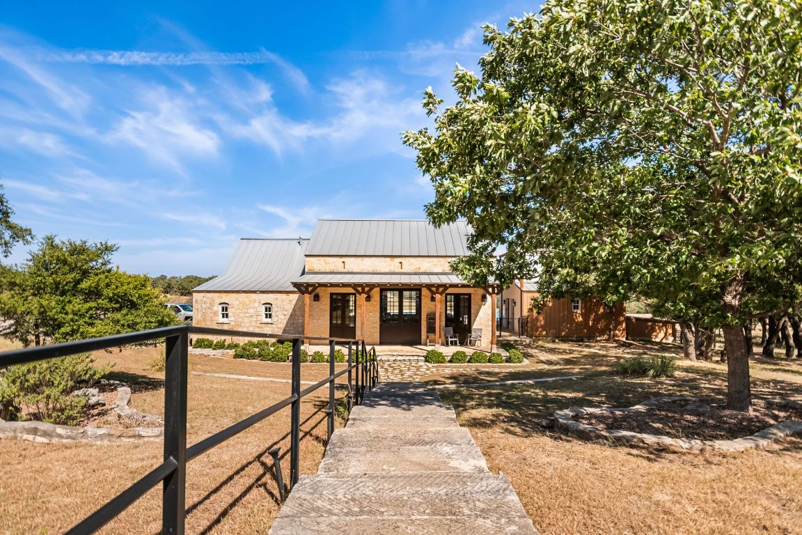 226 South Walnut Springs Road Johnson City, TX 78636 - Photo 21 of 26 a view of a house with large trees