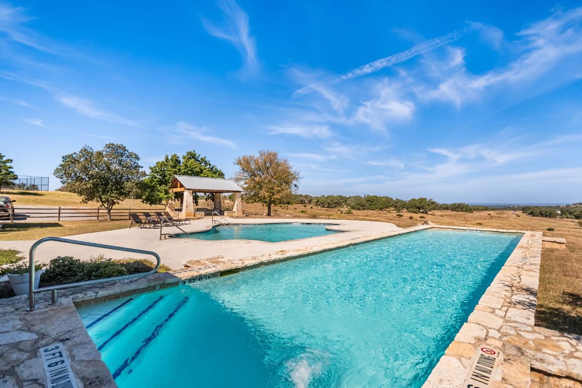 226 South Walnut Springs Road Johnson City, TX 78636 - Photo 23 of 26 a view of a lake with a yard