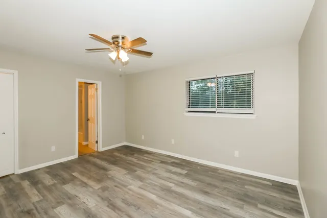 a view of an empty room with a window
