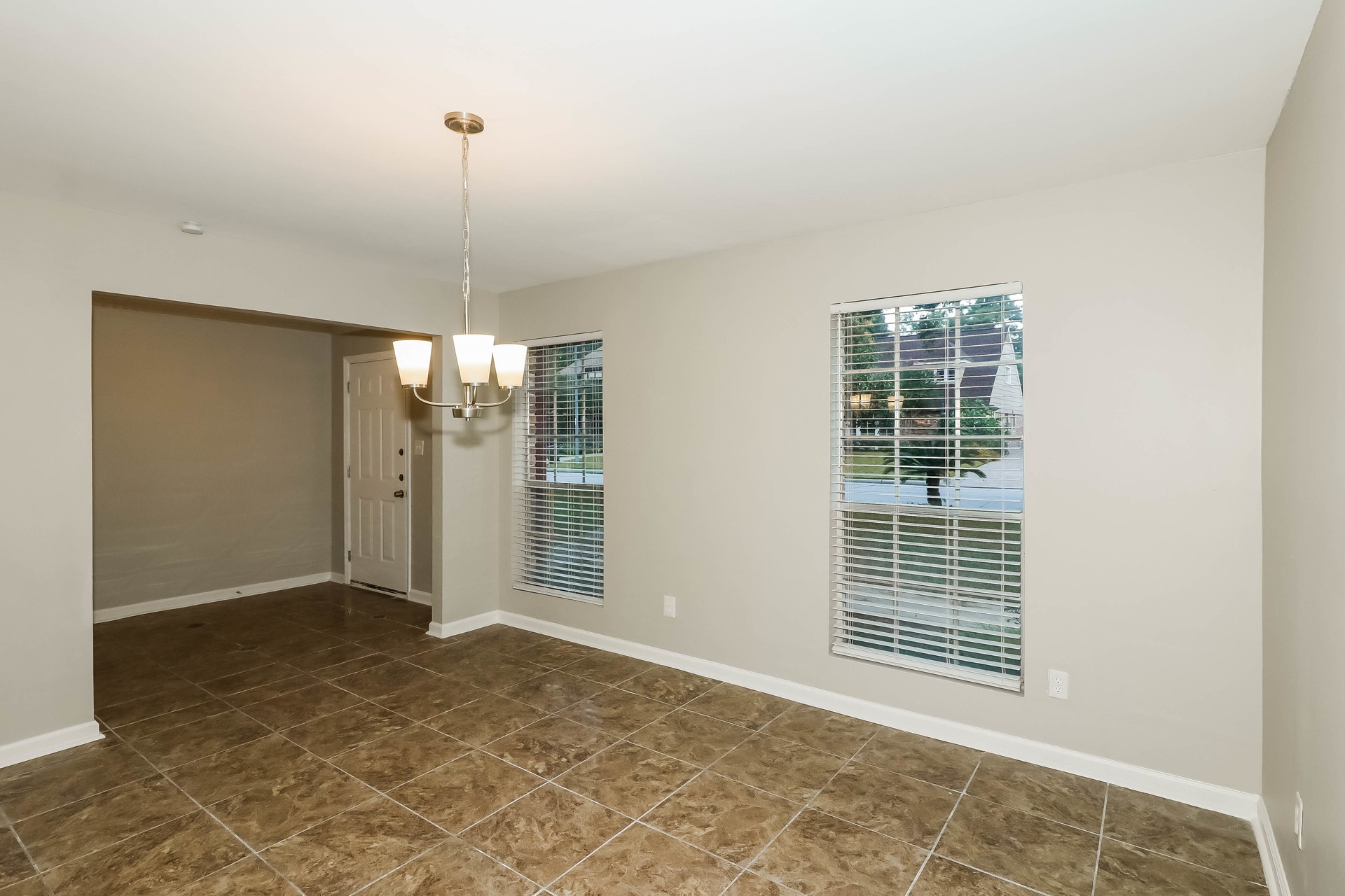 1506 Castlerock Road Houston, TX 77090 - Photo 4 of 23 a view of an empty room with a window