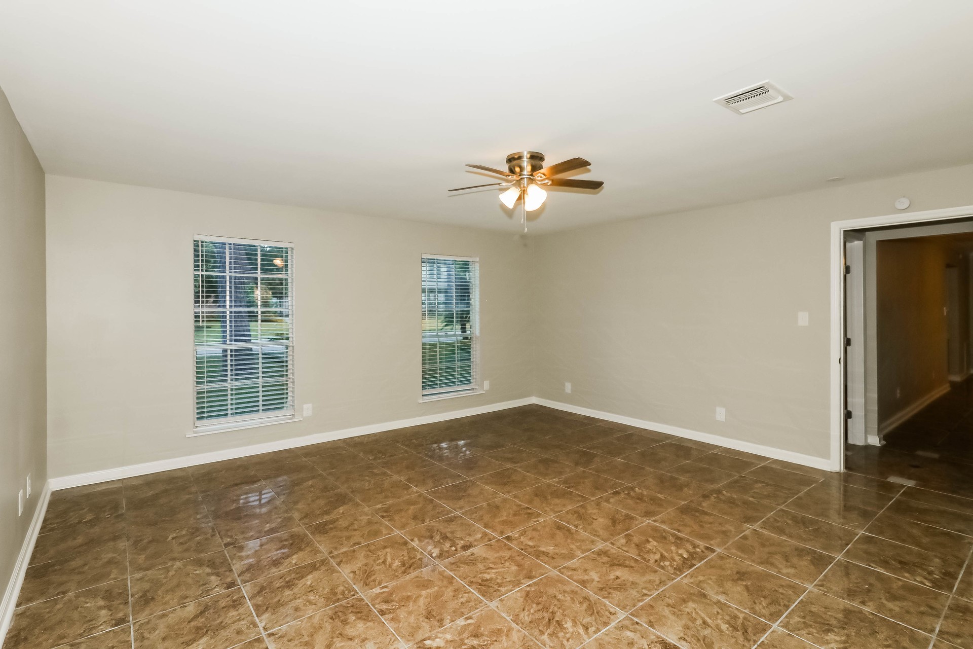 1506 Castlerock Road Houston, TX 77090 - Photo 9 of 23 a view of an empty room with a window