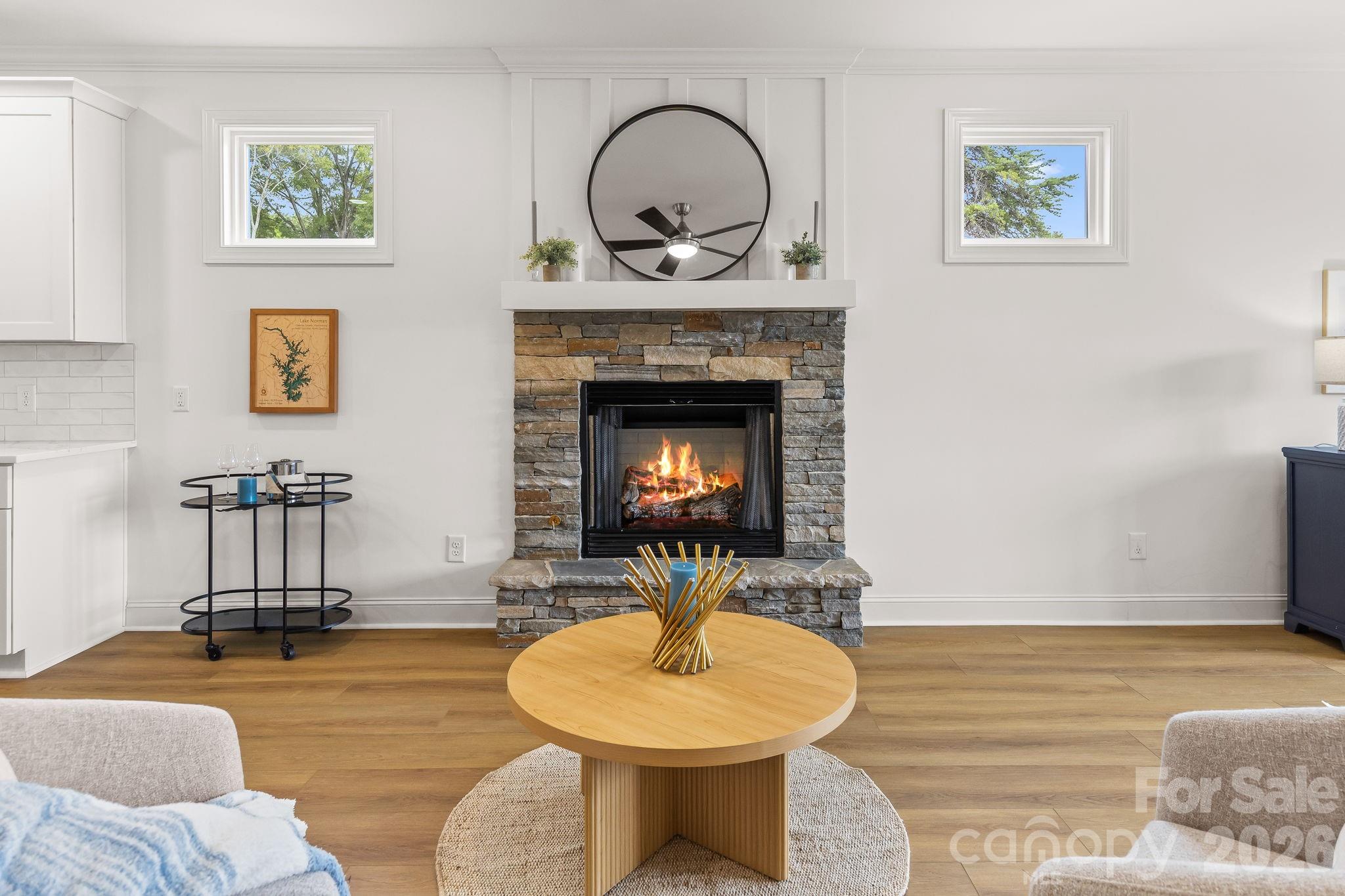 8078 Blackwood Road Denver, NC 28037 - Photo 13 of 48 a living room with furniture and a fireplace