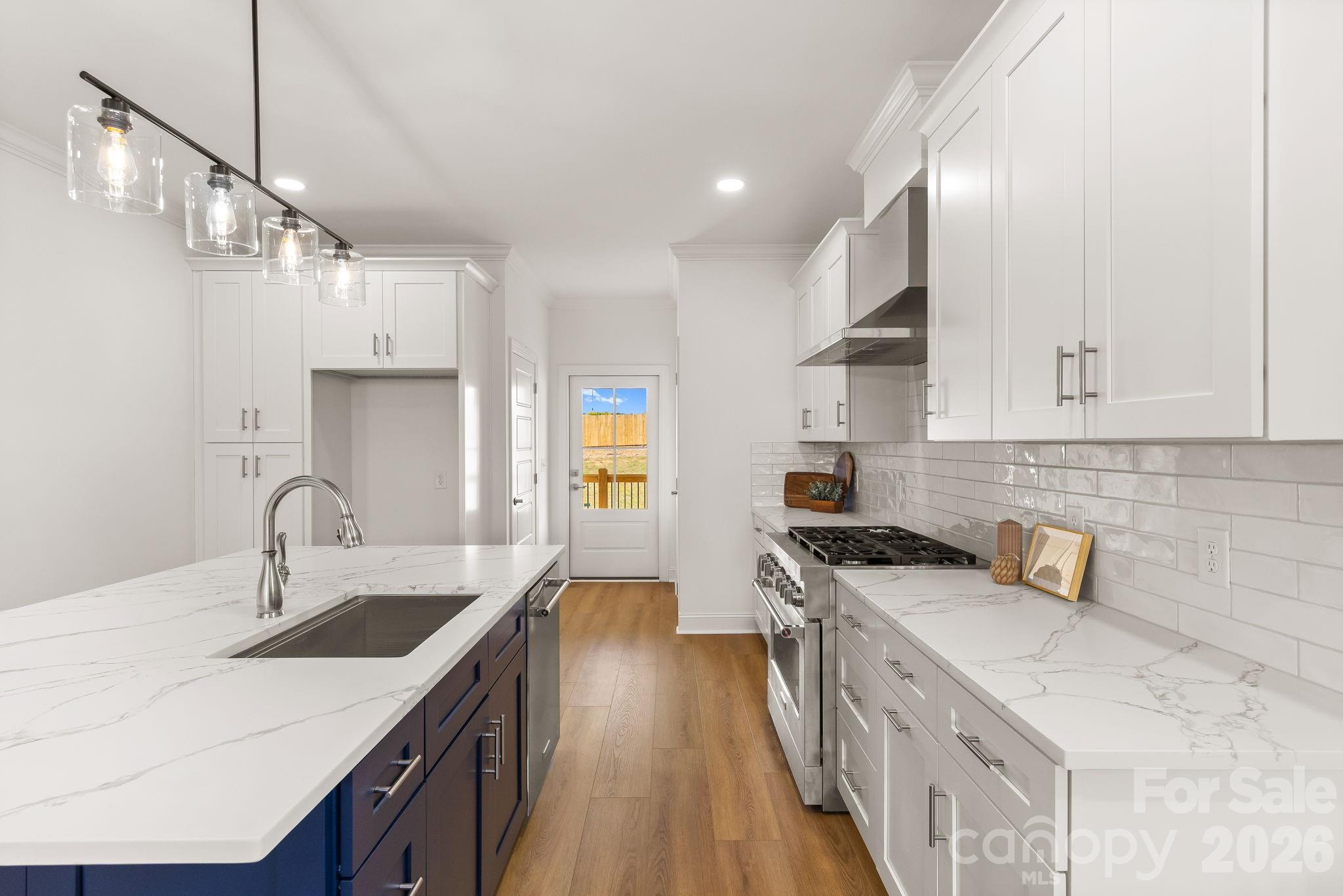 8078 Blackwood Road Denver, NC 28037 - Photo 17 of 48 a kitchen with stainless steel appliances granite countertop a sink stove and refrigerator