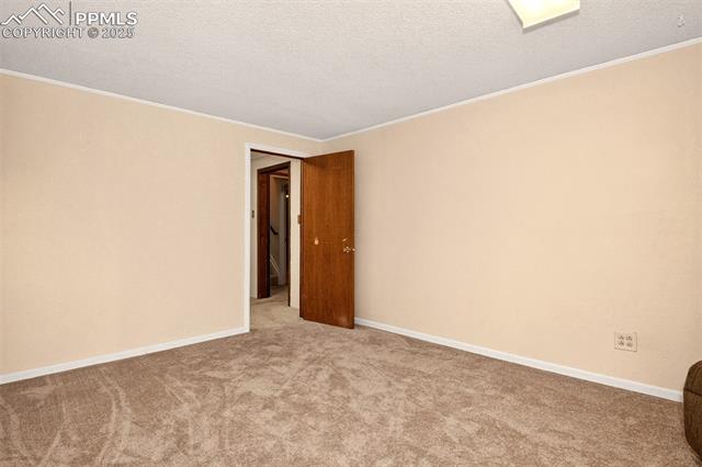 6723 Seneca Road Colorado Springs, CO 80915 - Photo 21 of 36 Baseent level bedroom