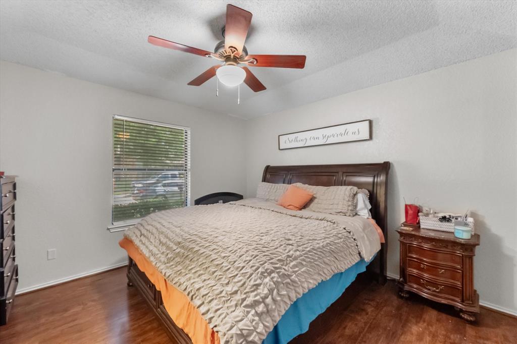 1312 Hackamore Street Mesquite, TX 75149 - Photo 22 of 28 a bedroom with a bed and a dresser