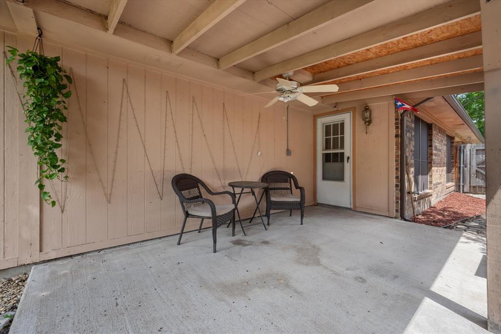 1312 Hackamore Street Mesquite, TX 75149 - Photo 26 of 28 a view of a patio with table and chairs and potted plants