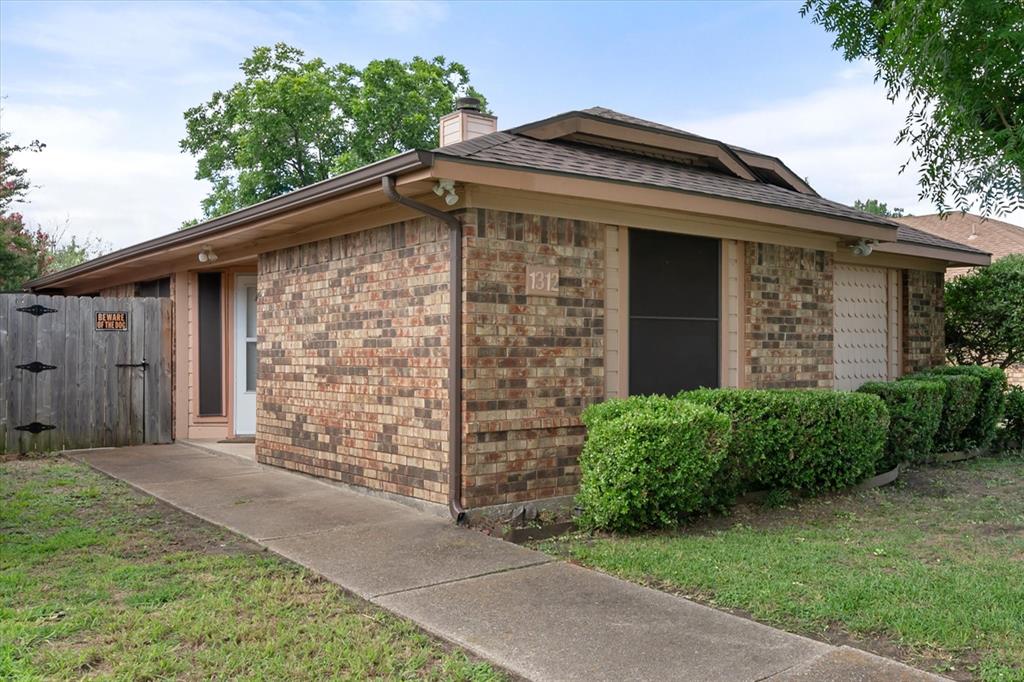 1312 Hackamore Street Mesquite, TX 75149 - Photo 3 of 28 a front view of a house with garden