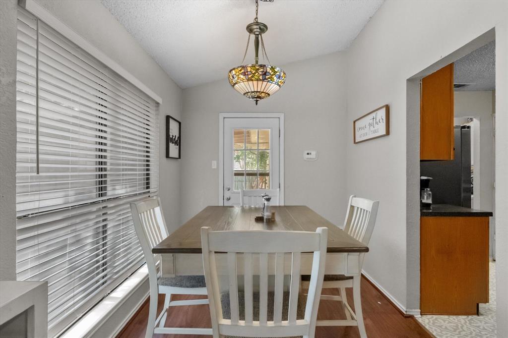 1312 Hackamore Street Mesquite, TX 75149 - Photo 7 of 28 a view of a dining room with furniture window and wooden floor