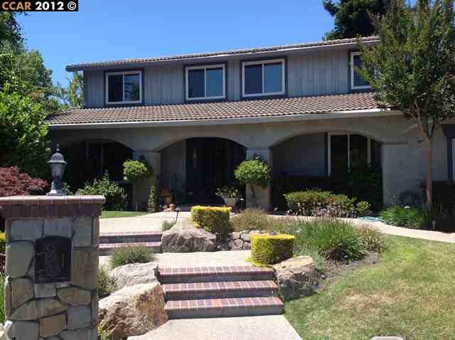 95 Carousel Place San Ramon, CA 94583 - Photo 1 of 1 a view of a white house with large windows and a small yard