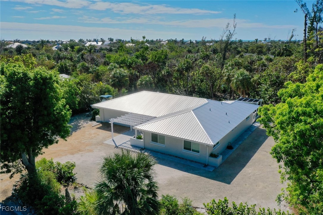 an aerial view of a house with mountain view
