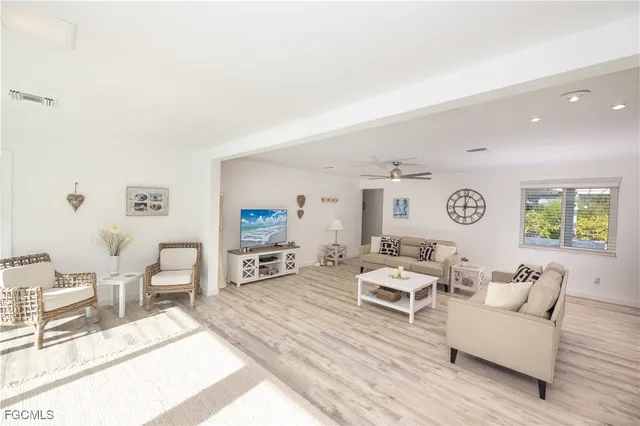 a view of a kitchen with granite countertop a large window and a sink