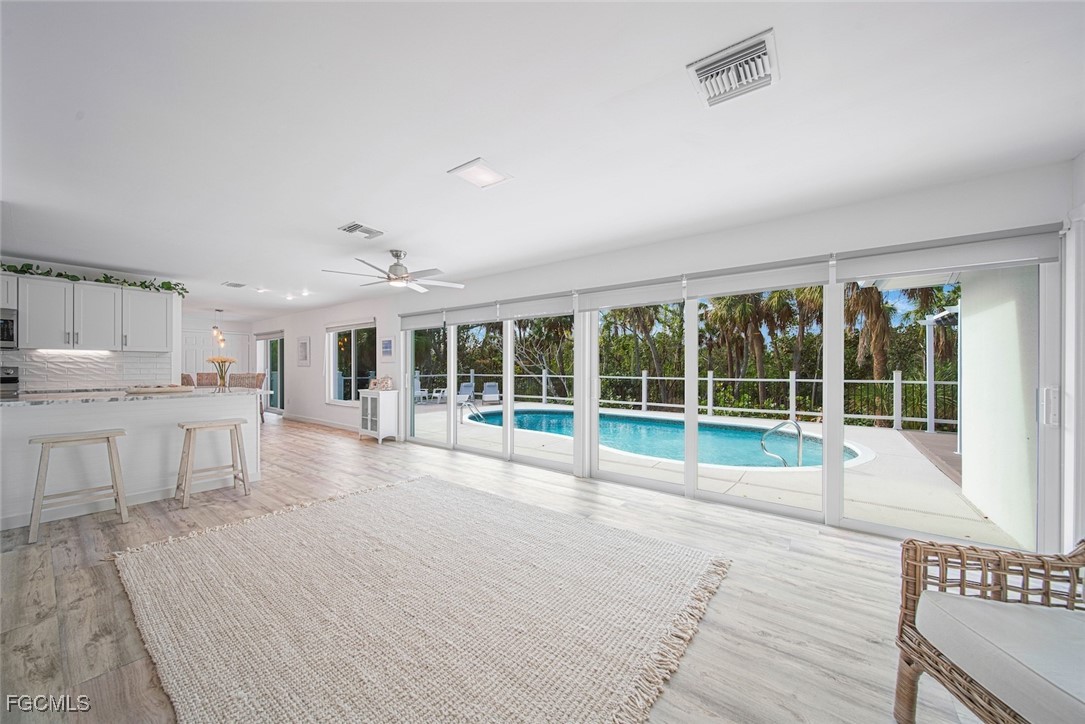 4639 Brainard Bayou Road Sanibel, FL 33957 - Photo 22 of 50 a view of a kitchen with granite countertop a large window and a sink
