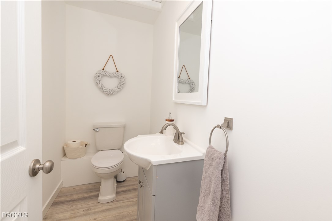 4639 Brainard Bayou Road Sanibel, FL 33957 - Photo 38 of 50 a bathroom with a sink a toilet and mirror