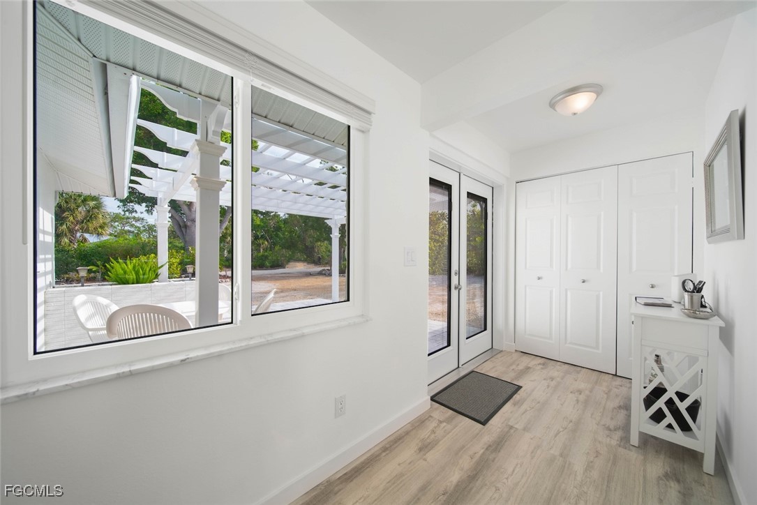 4639 Brainard Bayou Road Sanibel, FL 33957 - Photo 40 of 50 a view of livingroom with furniture and floor to ceiling window