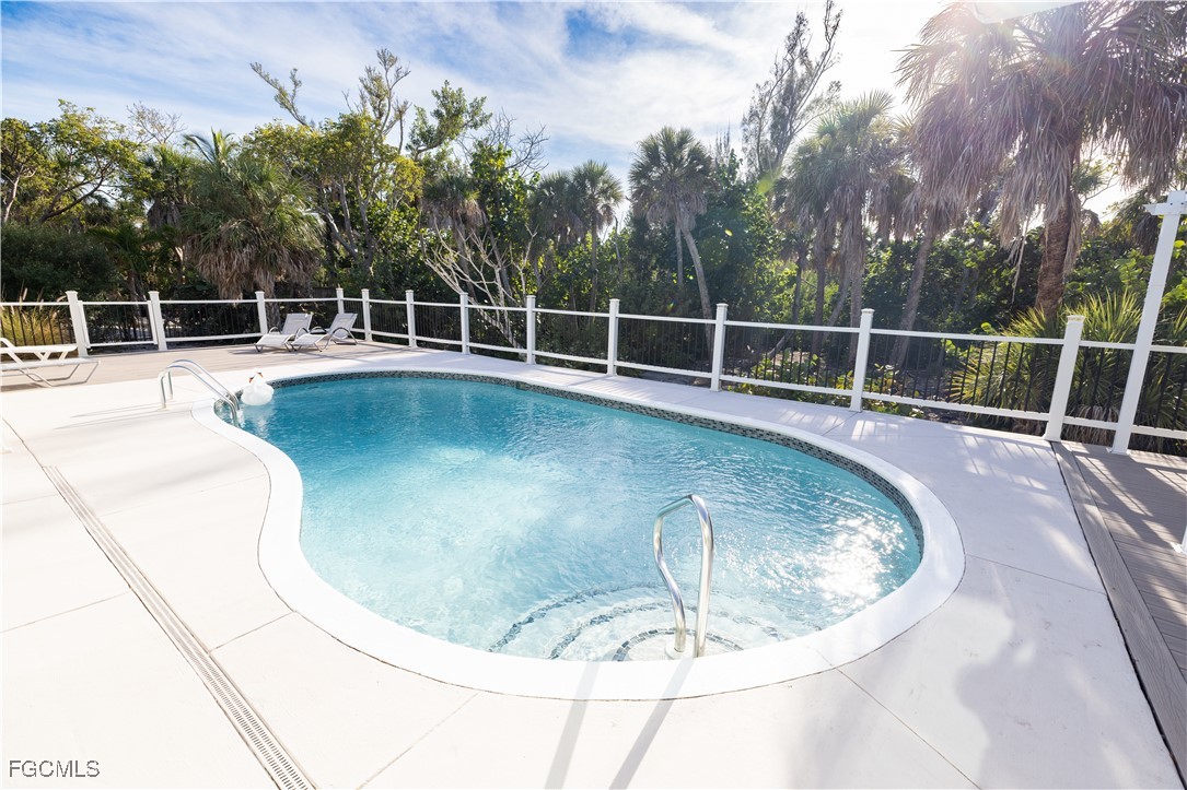 4639 Brainard Bayou Road Sanibel, FL 33957 - Photo 44 of 50 a view of a swimming pool with a sitting area