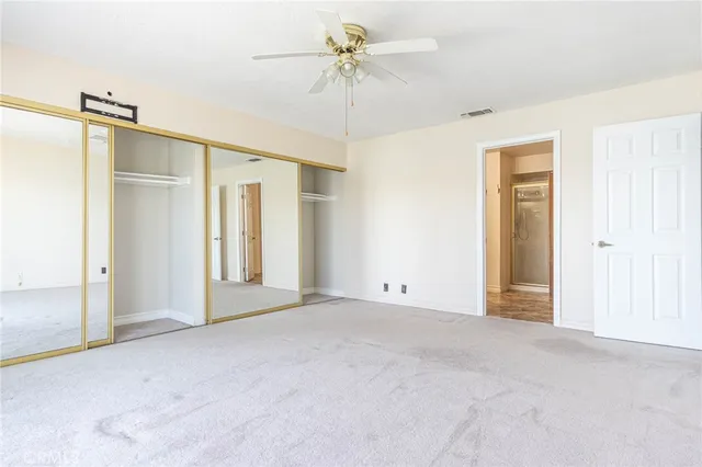 a view of a balcony with wooden floor and city view