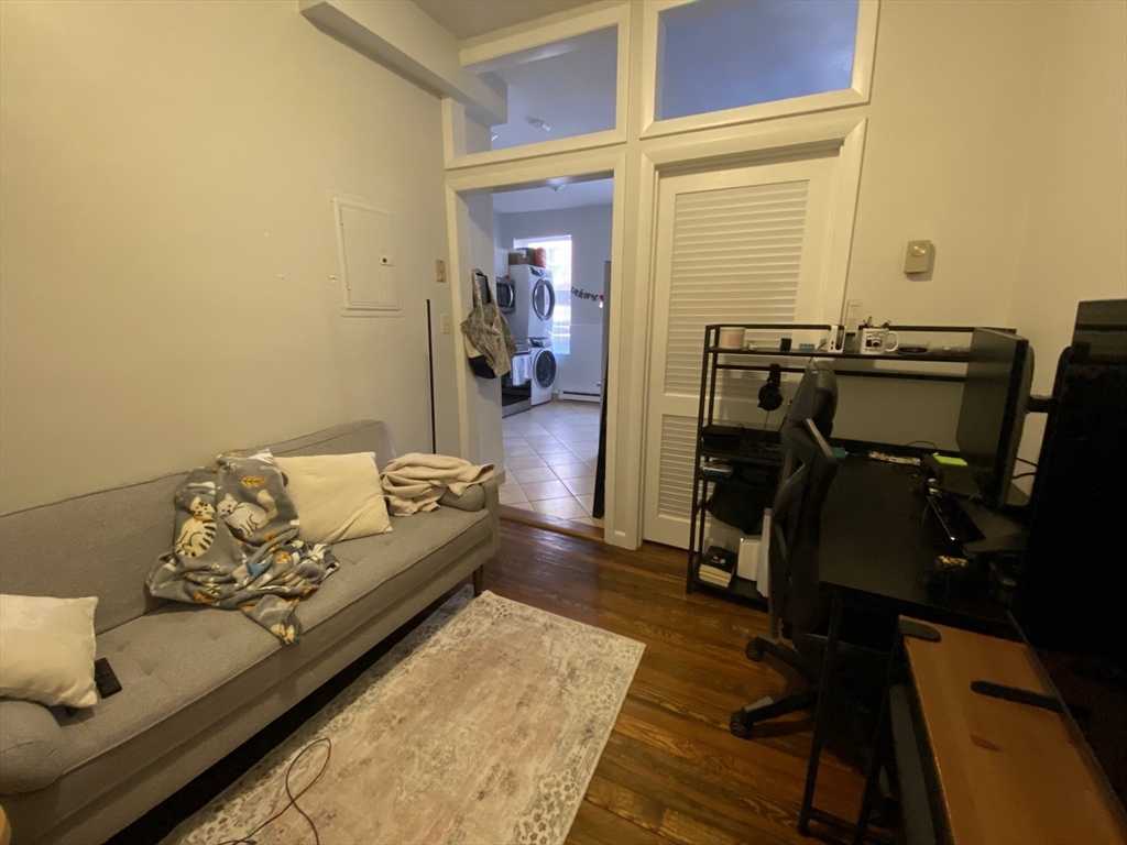 5 Battery Street, Unit 2F Boston, MA 02109 - Photo 11 of 15 a bed room with a bed and furniture