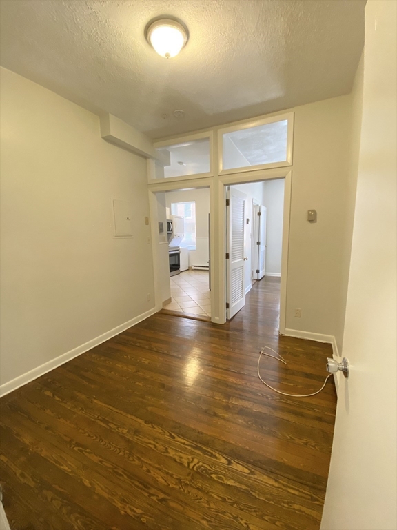 5 Battery Street, Unit 2F Boston, MA 02109 - Photo 3 of 15 a view of a room with wooden floor