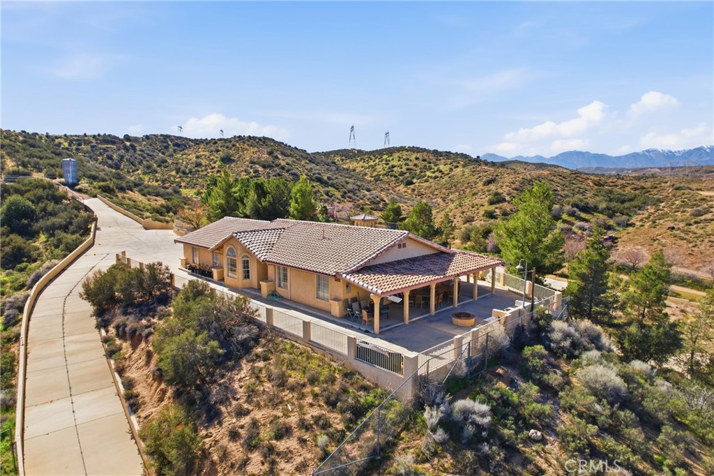 an aerial view of a house with a garden