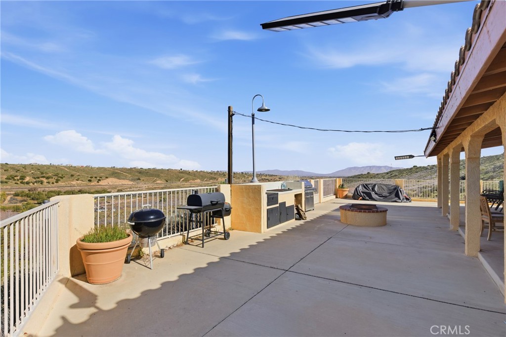 14455 Summit Valley Road Hesperia, CA 92345 - Photo 16 of 26 a view of roof deck with couch and chairs