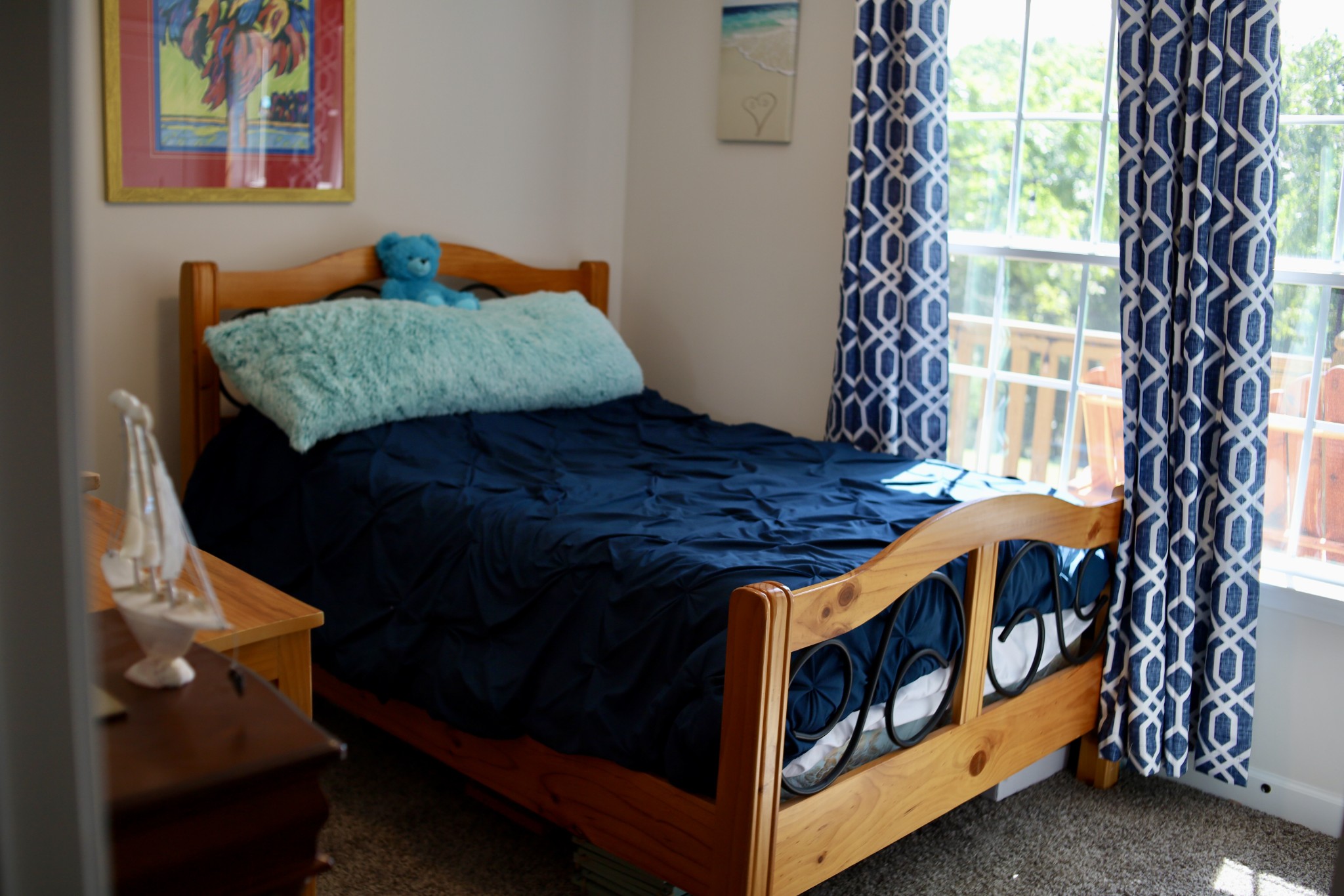 746 Nels Adams Road Dickson, TN 37055 - Photo 26 of 63 a bed sitting in a bedroom next to a window