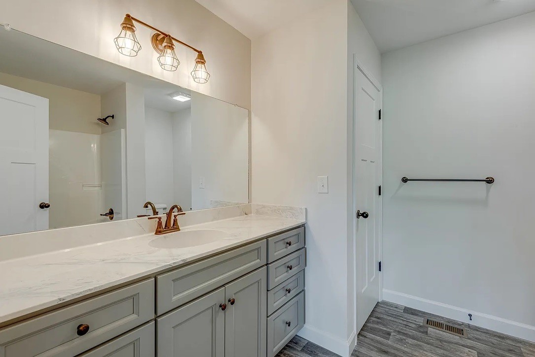 746 Nels Adams Road Dickson, TN 37055 - Photo 31 of 63 a bathroom with a sink and a mirror