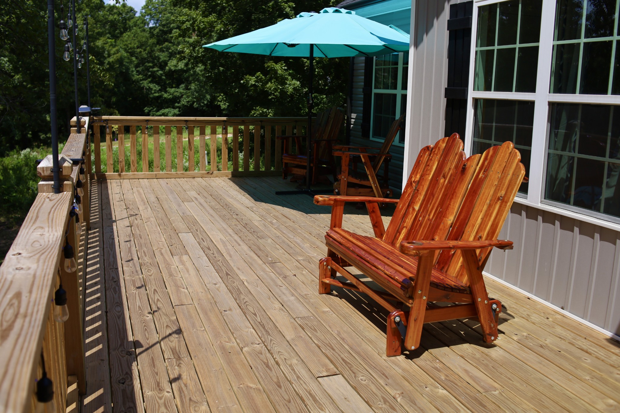 746 Nels Adams Road Dickson, TN 37055 - Photo 37 of 63 a balcony with wooden floor table and chairs