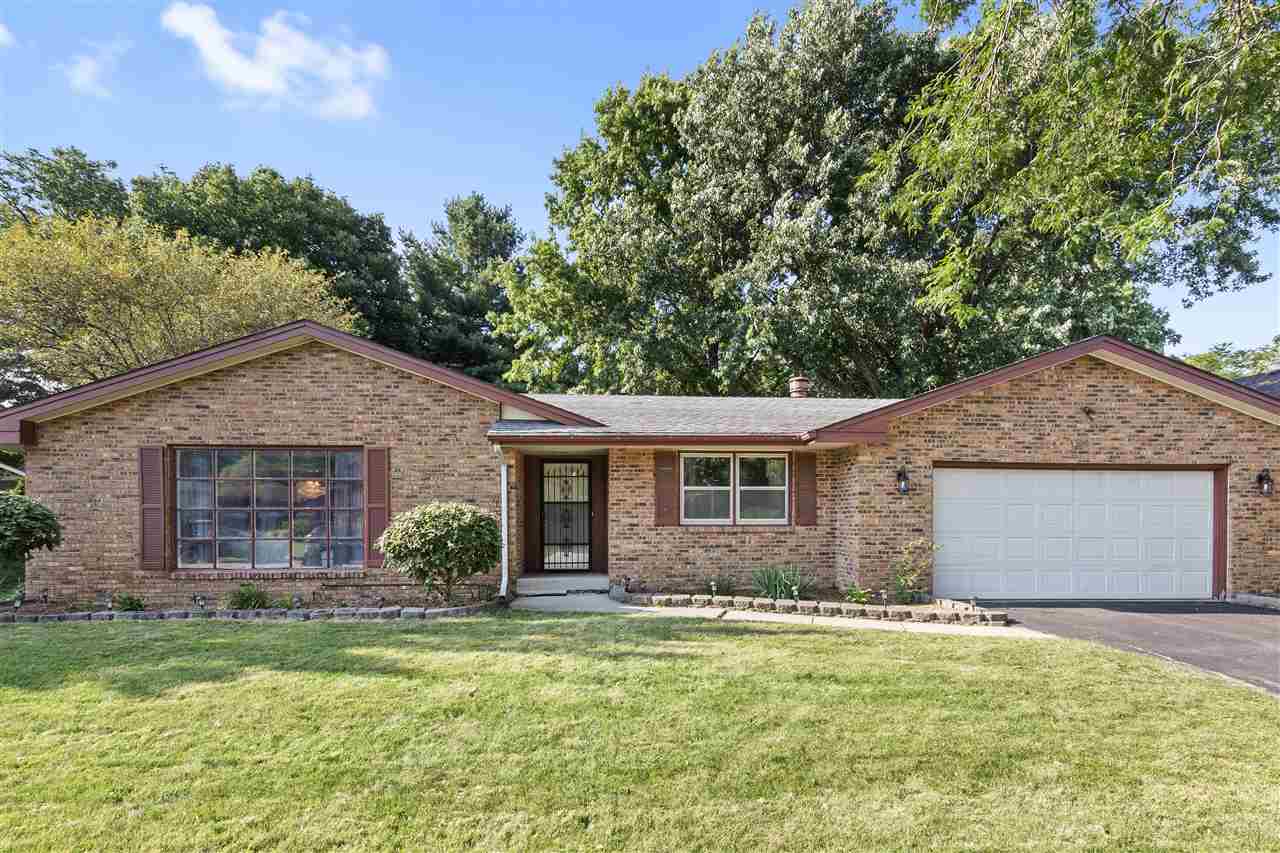 4570 Sunderman Road Rockford, IL 61114 - Photo 1 of 17 a front view of house with yard and green space