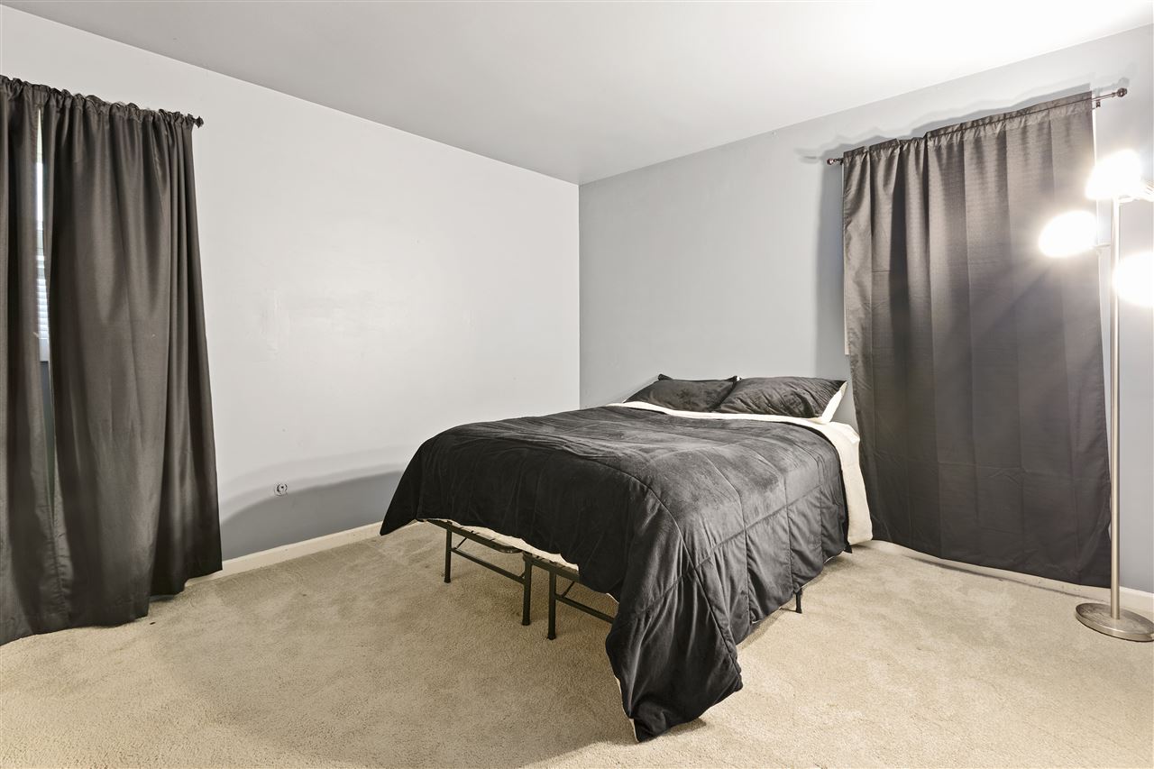 4570 Sunderman Road Rockford, IL 61114 - Photo 14 of 17 a bedroom with a bed and a walk in closet