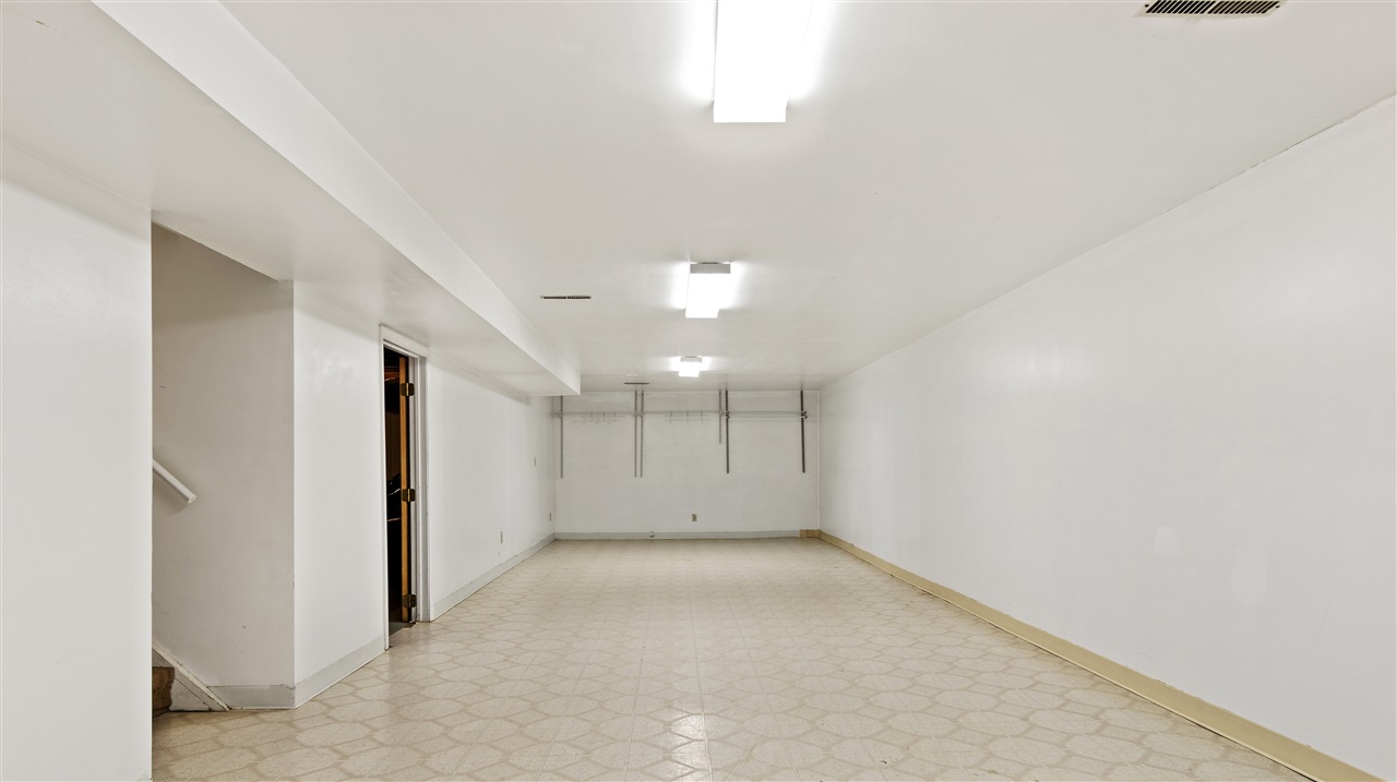 4570 Sunderman Road Rockford, IL 61114 - Photo 15 of 17 an empty room with a empty space and windows