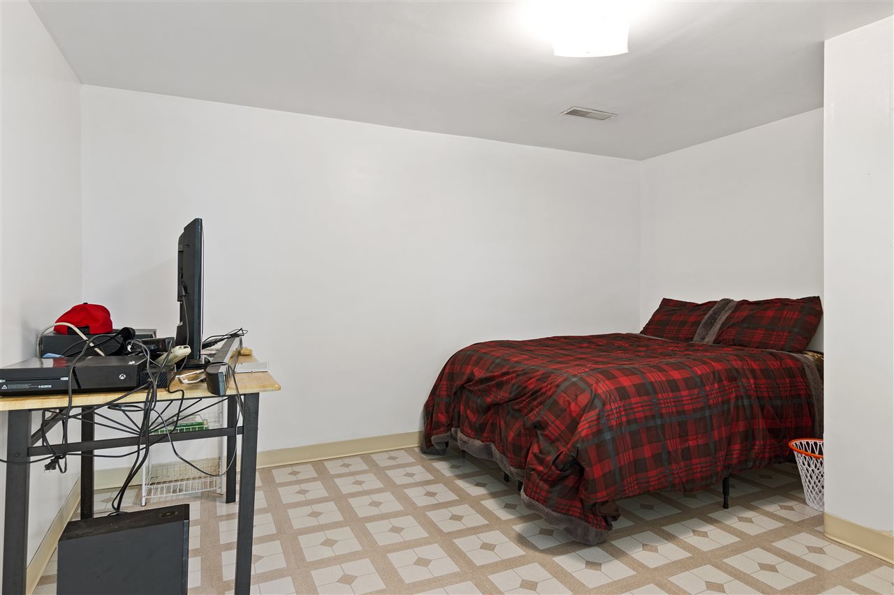 4570 Sunderman Road Rockford, IL 61114 - Photo 16 of 17 a bed sitting in a bedroom next to a window