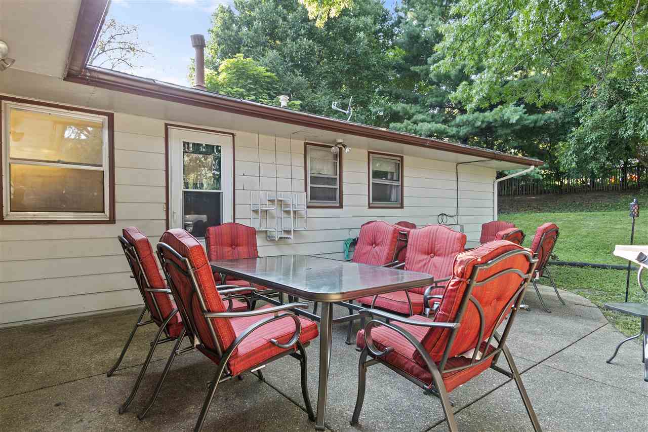 4570 Sunderman Road Rockford, IL 61114 - Photo 17 of 17 a backyard of a house with table and chairs