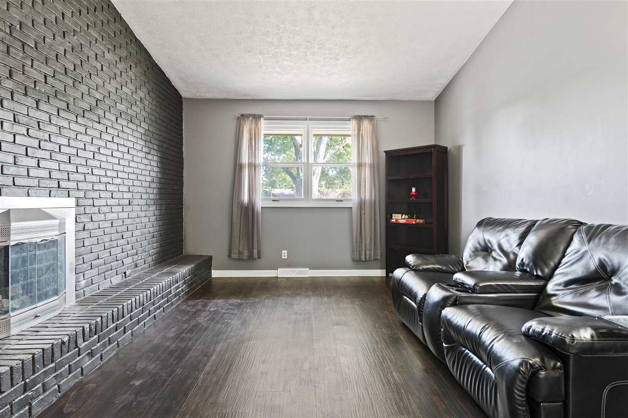 4570 Sunderman Road Rockford, IL 61114 - Photo 9 of 17 a living room with furniture and wooden floor